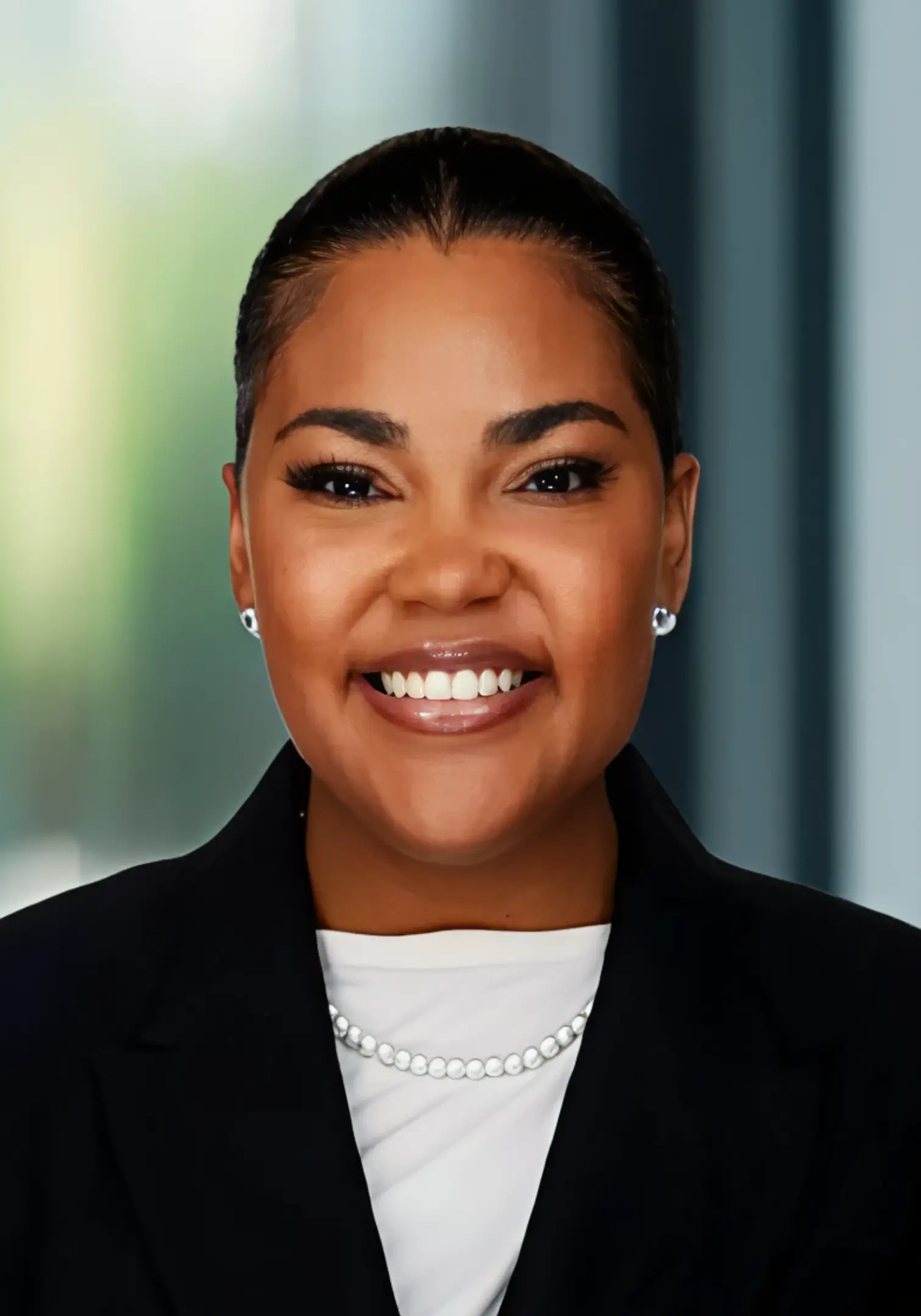 Smiling businesswoman in black blazer.