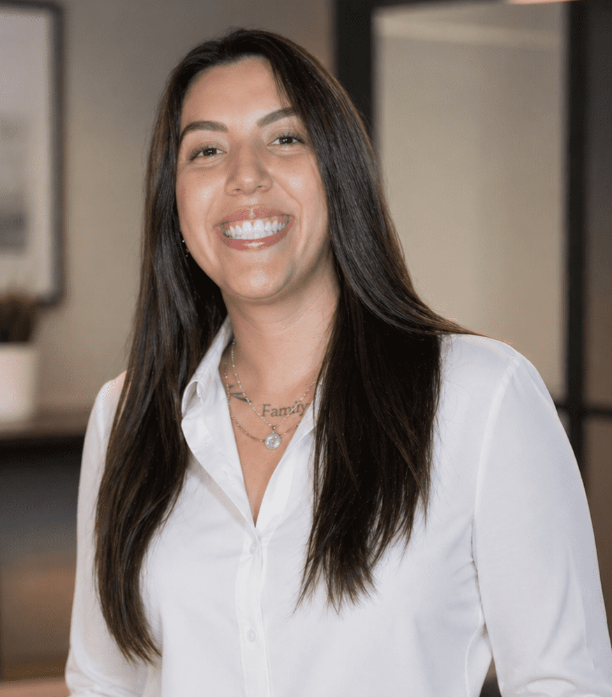 Smiling woman in white blouse, long hair