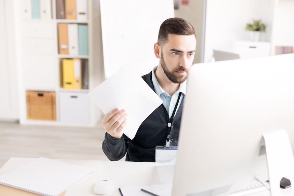 a person working in the office on paperwork