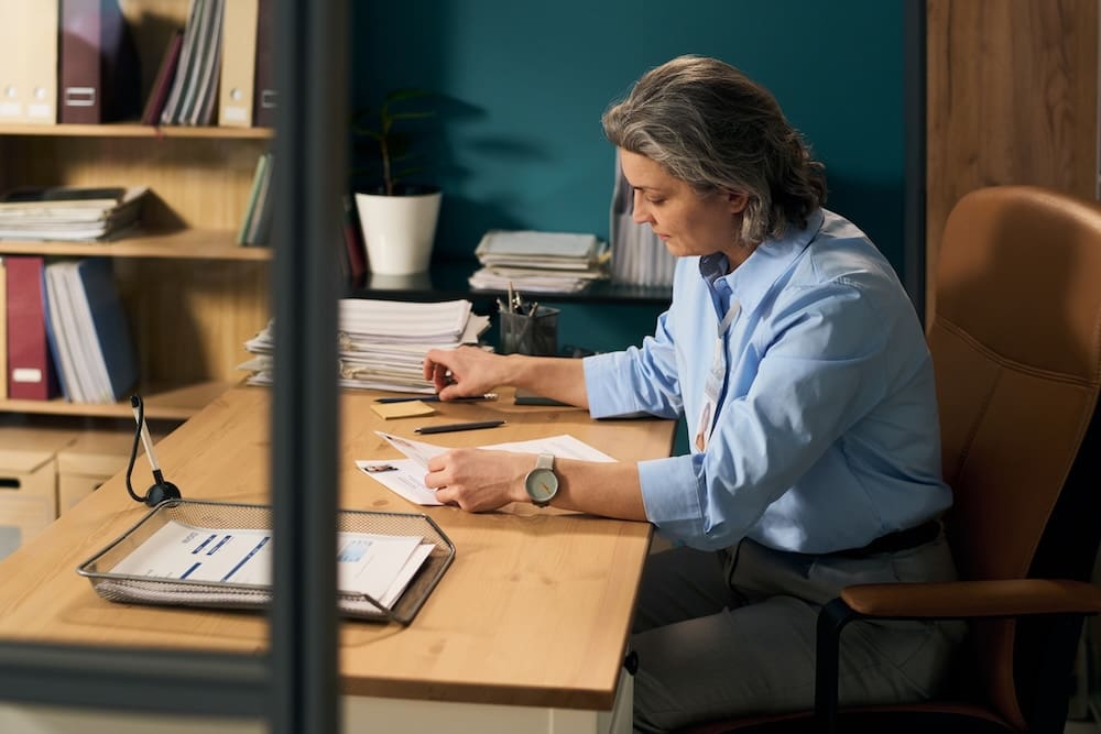 an employee reviewing paperwork