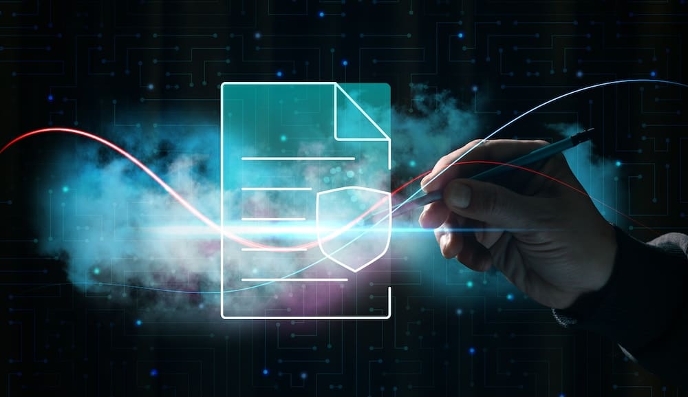 Hand holding a pen drawing a glowing line through an image of a file with a shield symbolizing data protection and security. Concept of digital signature and document protection on the Internet