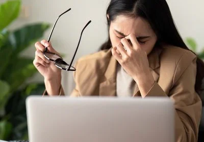 Woman stressed at her work desk