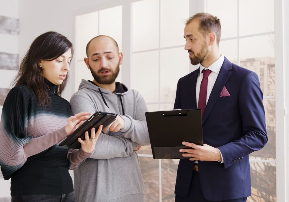 a group of people going over a contract