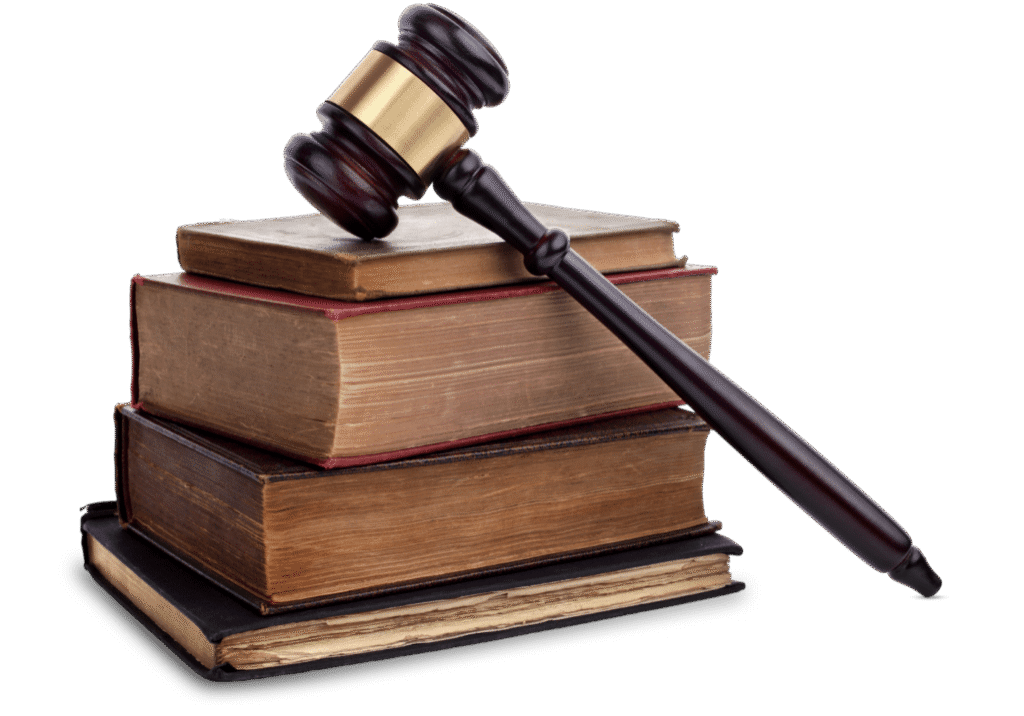 Gavel on stack of old law books.