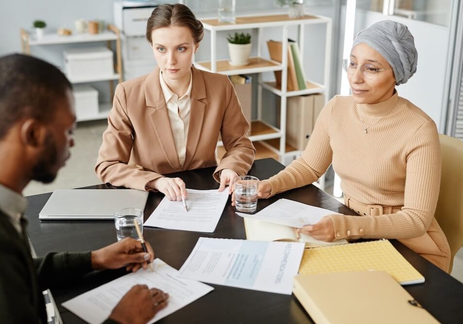 A group of people having a meeting in the HR department