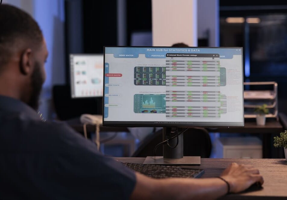 Person analyzing data dashboard on monitor