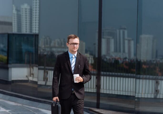 a man walking back to his office building