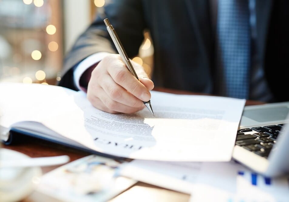 a man reading through a contract