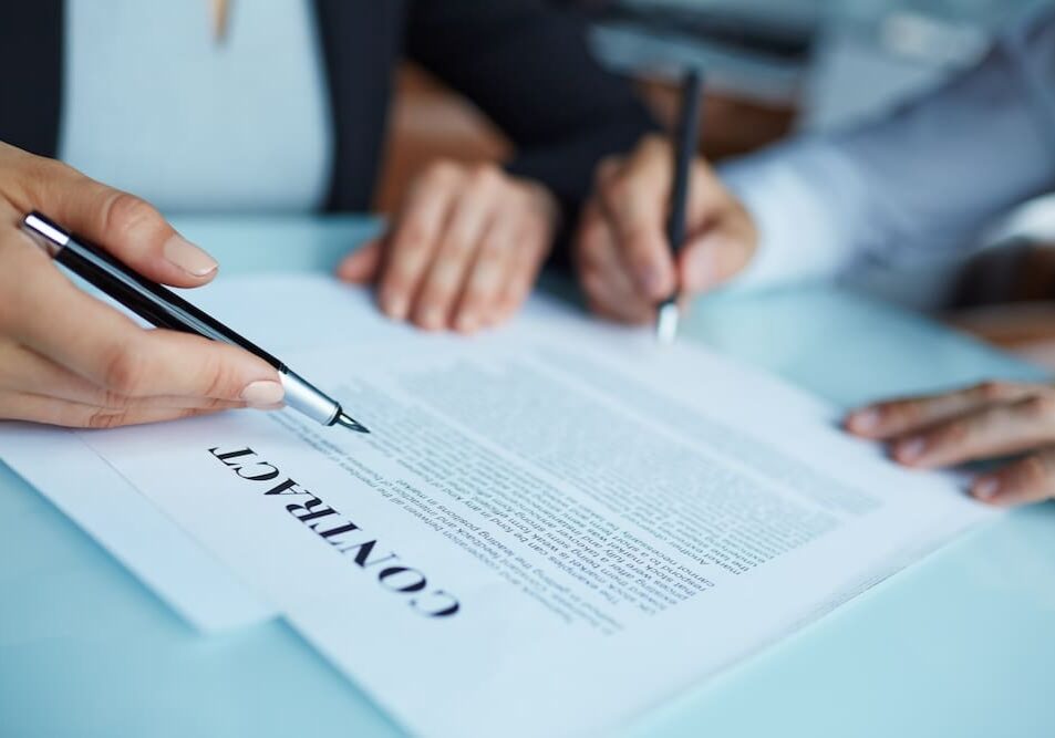 people signing a contract