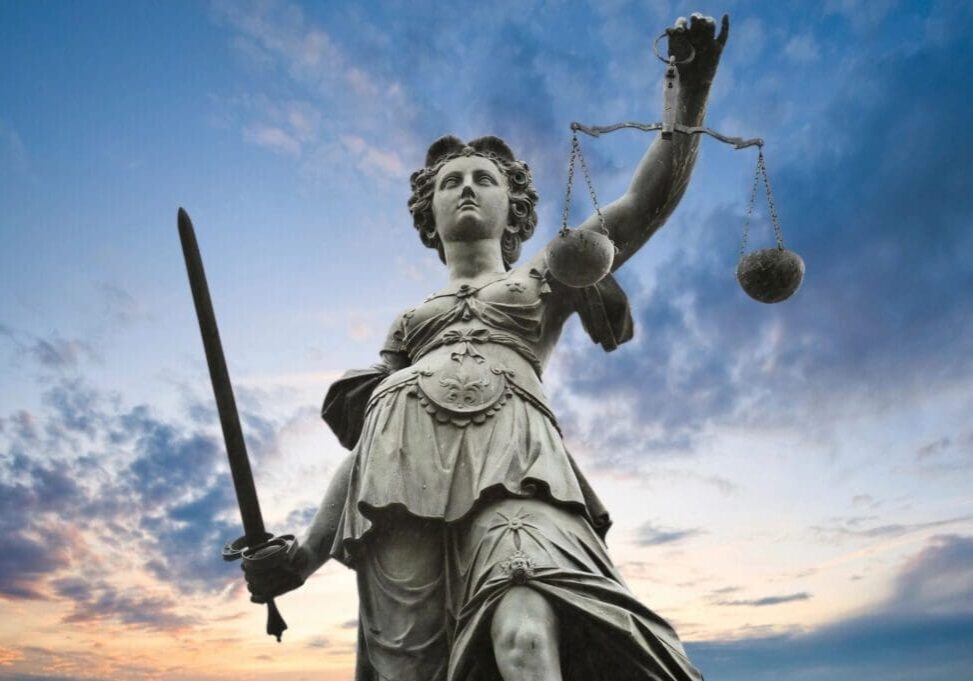 Lady Justice statue with sword and scales.