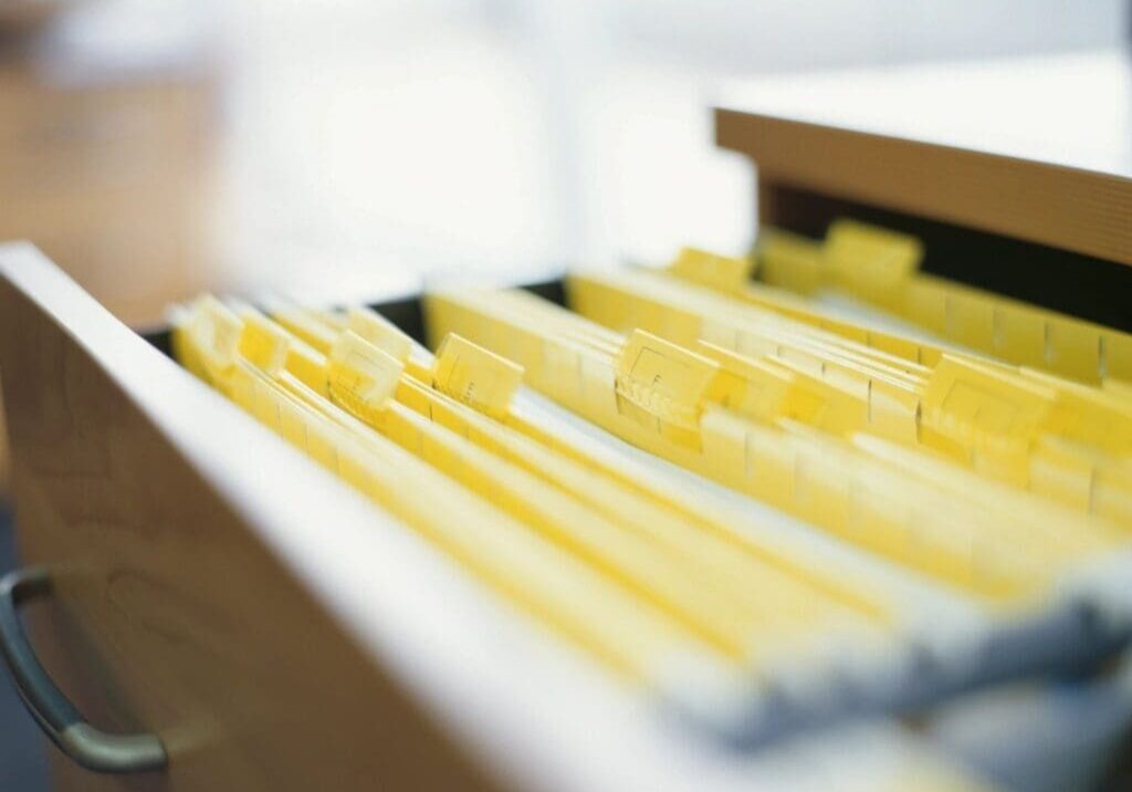 Open drawer with yellow file folders.